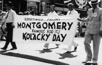 Men carrying Kolacky Day banner in parade